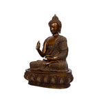 Brass Buddha sitting on base