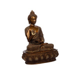 Brass Buddha sitting on base